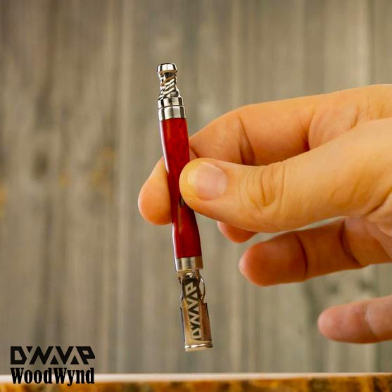 Holding the The WoodWynd Vaporizer by DynaVap NZ