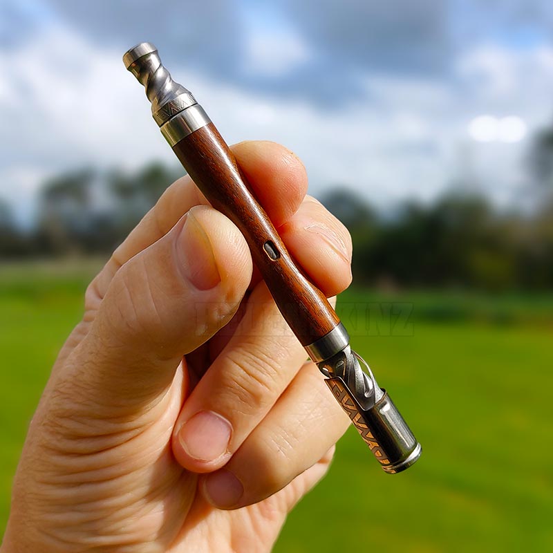 Holding the The WoodWynd Vaporizer by DynaVap NZ